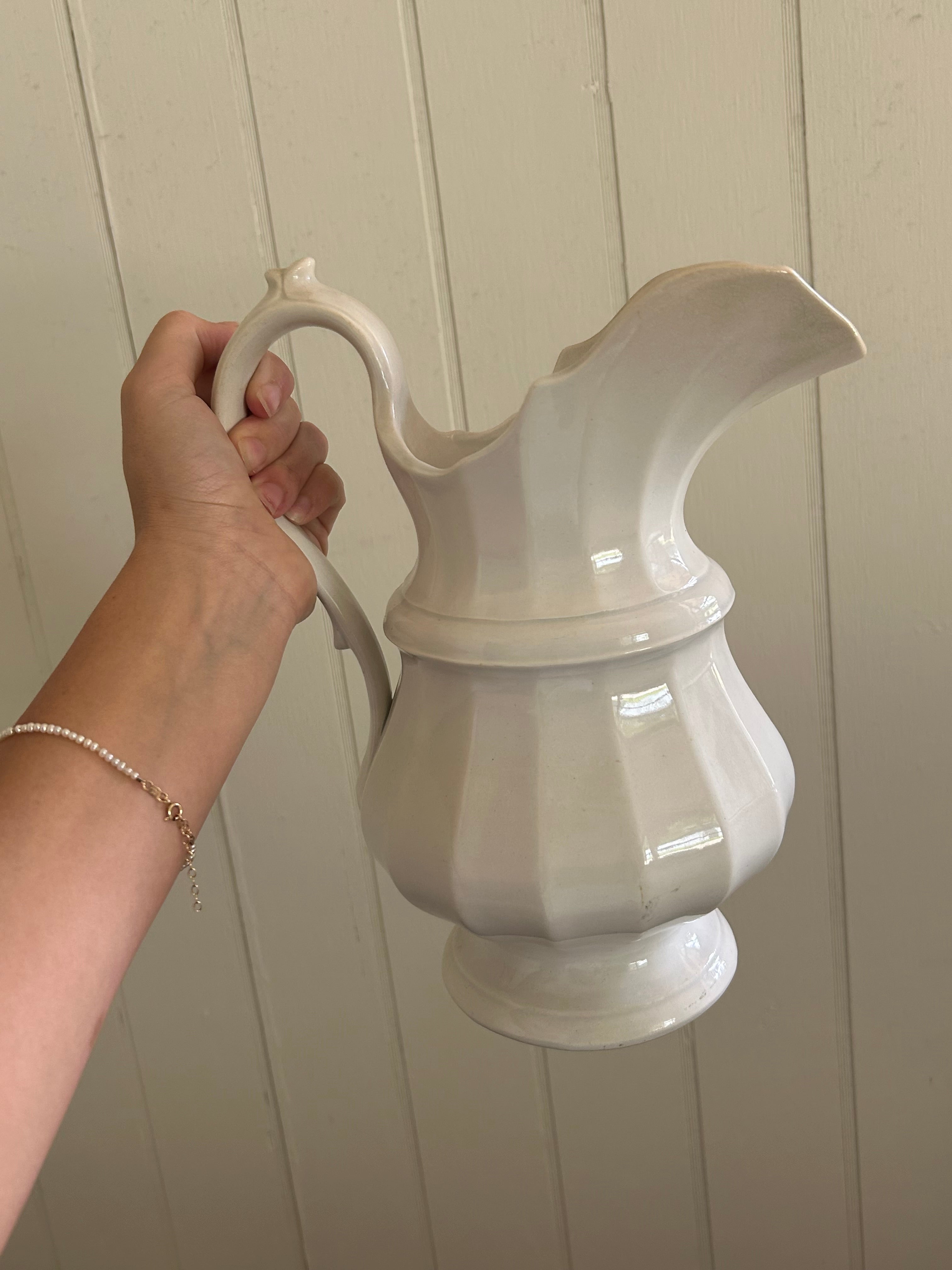 Antique white pitcher