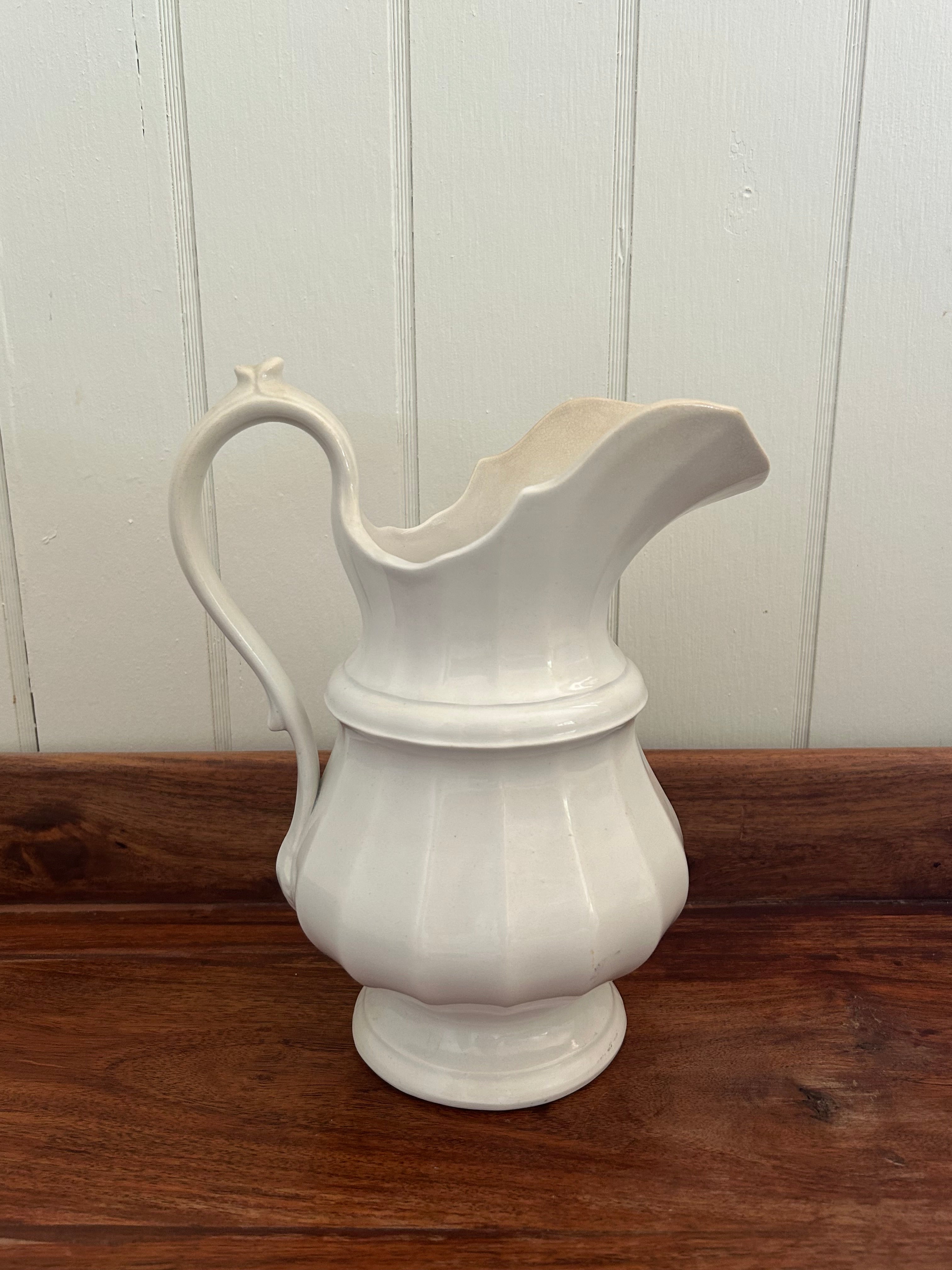 Antique white pitcher