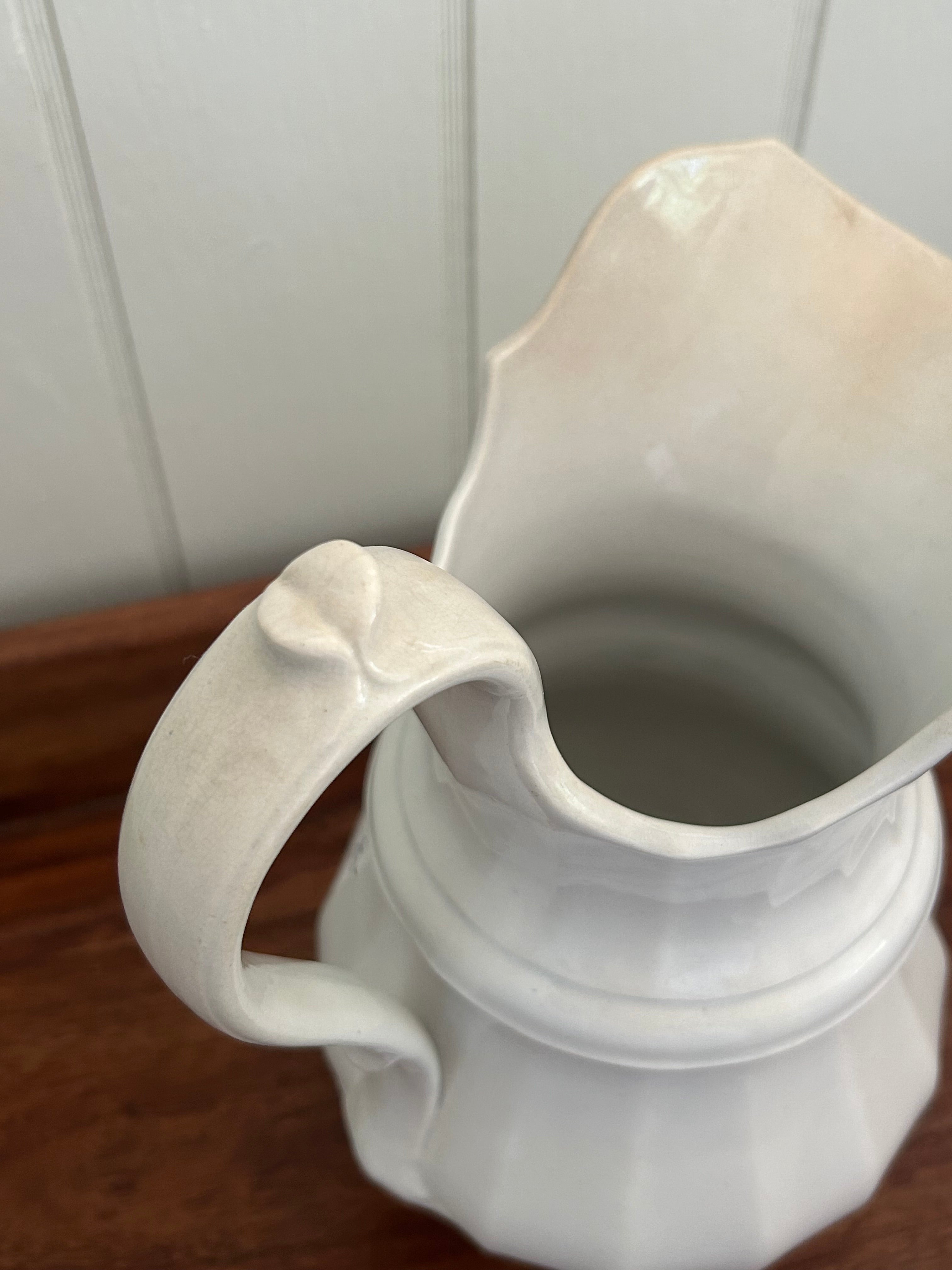 Antique white pitcher